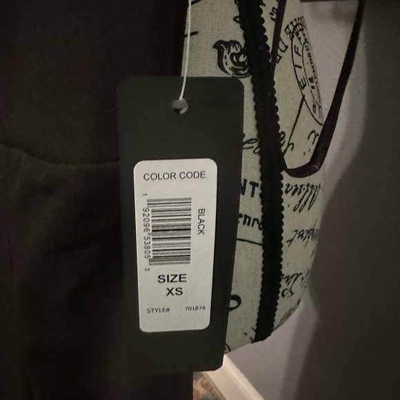 Bebe NWT jumpsuit. Black. Sexy slits up leg. Has stretch. Xs - Picture 2 of 6